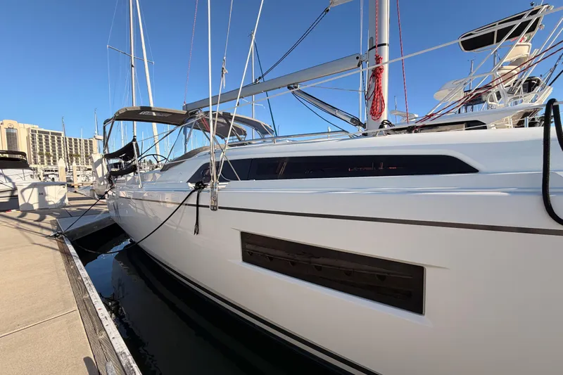  Yacht Photos Pics 2020 Beneteau Oceanis 30.1 sailboat docked at marina under clear blue sky.