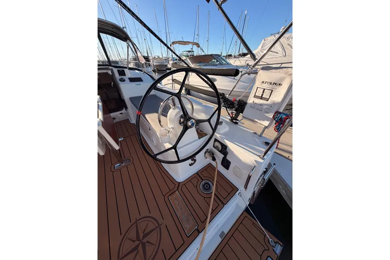 Yacht Photos Pics Cockpit of 2020 Beneteau Oceanis 30.1 sailboat with wooden deck and steering wheel.
