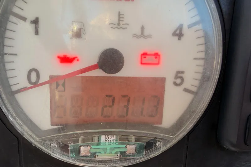  Yacht Photos Pics Close-up of Beneteau Oceanis 30.1 gauge panel showing warning lights and odometer reading.