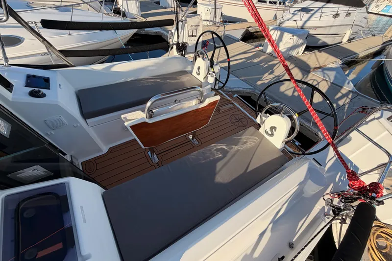  Yacht Photos Pics 2020 Beneteau Oceanis 30.1 sailboat cockpit with dual steering wheels and seating.