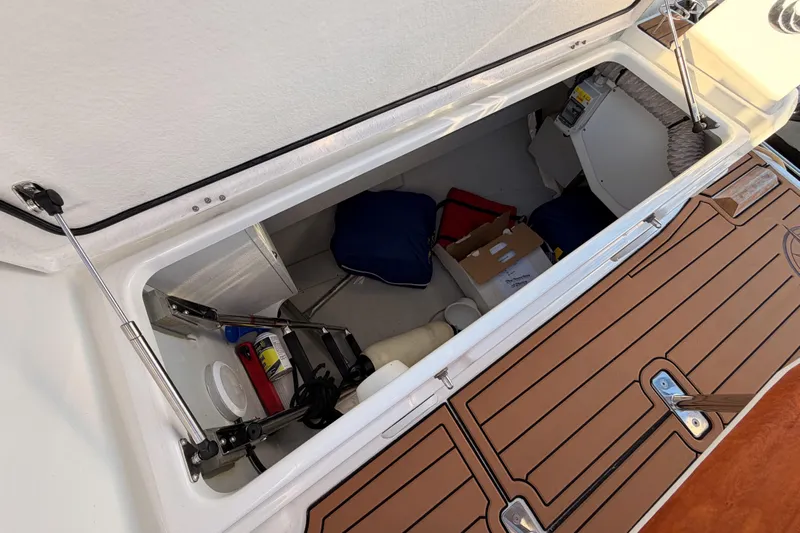  Yacht Photos Pics Storage compartment of a 2020 Beneteau Oceanis 30.1 sailboat, featuring various equipment.