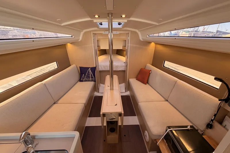  Yacht Photos Pics Interior of 2020 Beneteau Oceanis 30.1 yacht, featuring cozy seating and modern design.