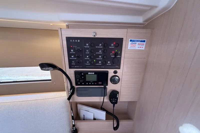  Yacht Photos Pics Control panel inside 2020 Beneteau Oceanis 30.1 yacht, featuring navigation and communication equipment.