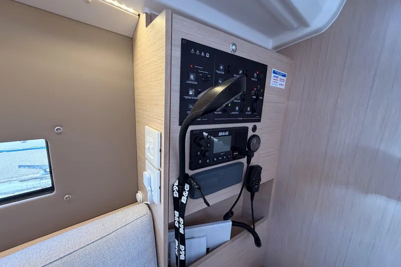 Yacht Photos Pics Control panel inside 2020 Beneteau Oceanis 30.1 yacht, featuring navigation and communication equipment.