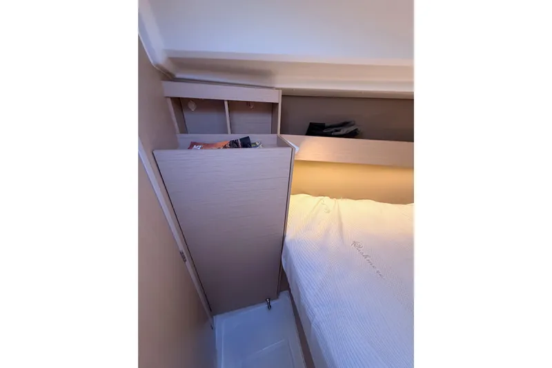  Yacht Photos Pics Interior cabin of 2020 Beneteau Oceanis 30.1 yacht with storage and bed.