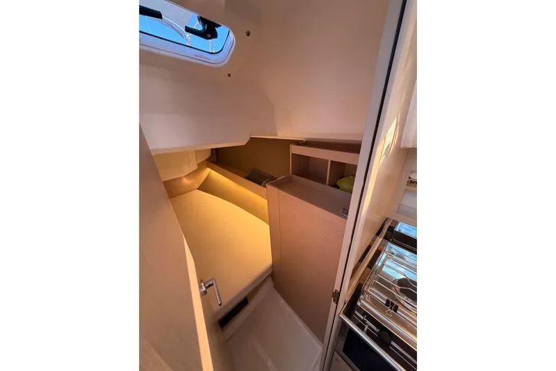  Yacht Photos Pics Interior cabin of 2020 Beneteau Oceanis 30.1 yacht, featuring cozy sleeping area.