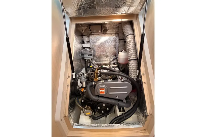  Yacht Photos Pics Engine compartment of a 2020 Beneteau Oceanis 30.1 sailboat, showcasing mechanical components.