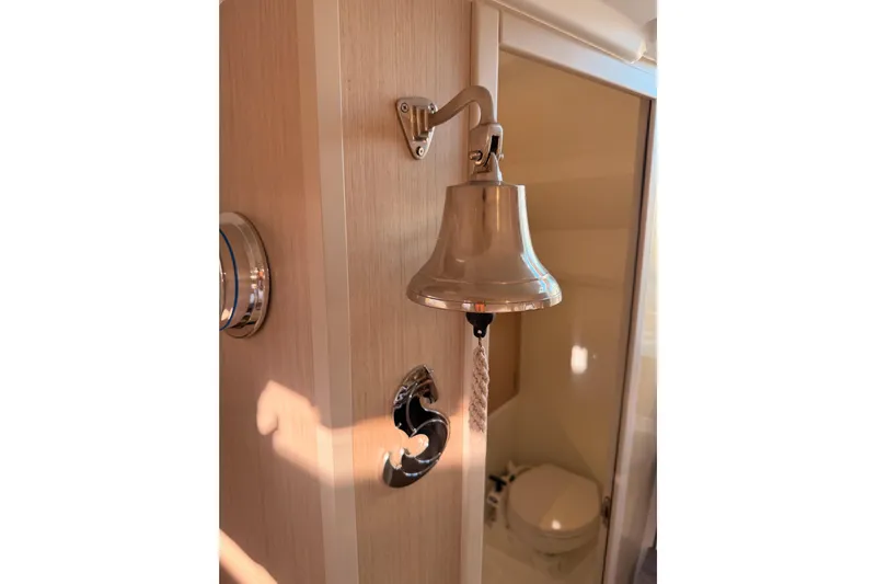  Yacht Photos Pics Interior of 2020 Beneteau Oceanis 30.1 yacht with bell and bathroom view.