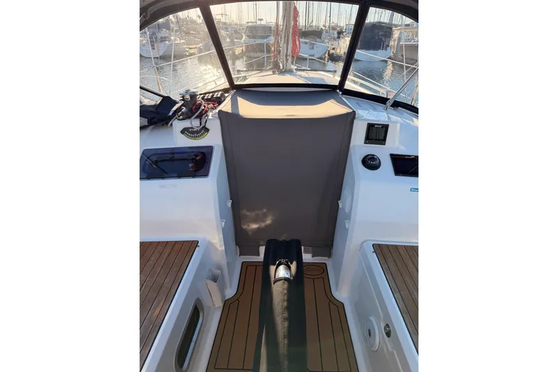  Yacht Photos Pics Cockpit view of 2020 Beneteau Oceanis 30.1 sailboat, featuring teak flooring and marina backdrop.