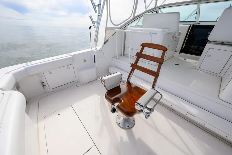 Marlin Spike Yacht Photos Pics 1998 Bertram 36 Moppie boat interior with fishing chair and white seating.