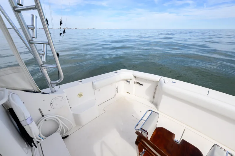 Marlin Spike Yacht Photos Pics 1998 Bertram 36 Moppie boat deck with ocean view and fishing equipment.