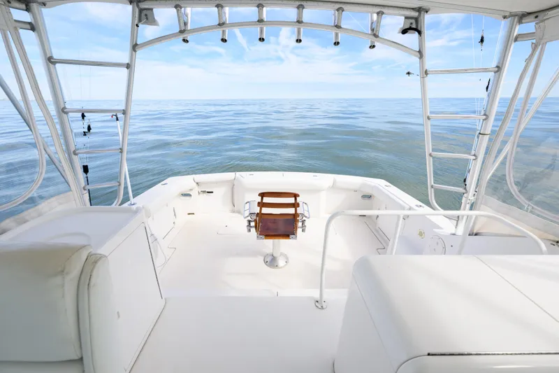 Marlin Spike Yacht Photos Pics 1998 Bertram 36 Moppie boat interior with ocean view, featuring fishing chair and equipment.