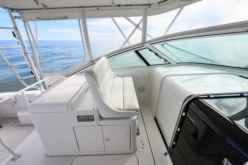 Marlin Spike Yacht Photos Pics 1998 Bertram 36 Moppie boat interior with white seating and ocean view.
