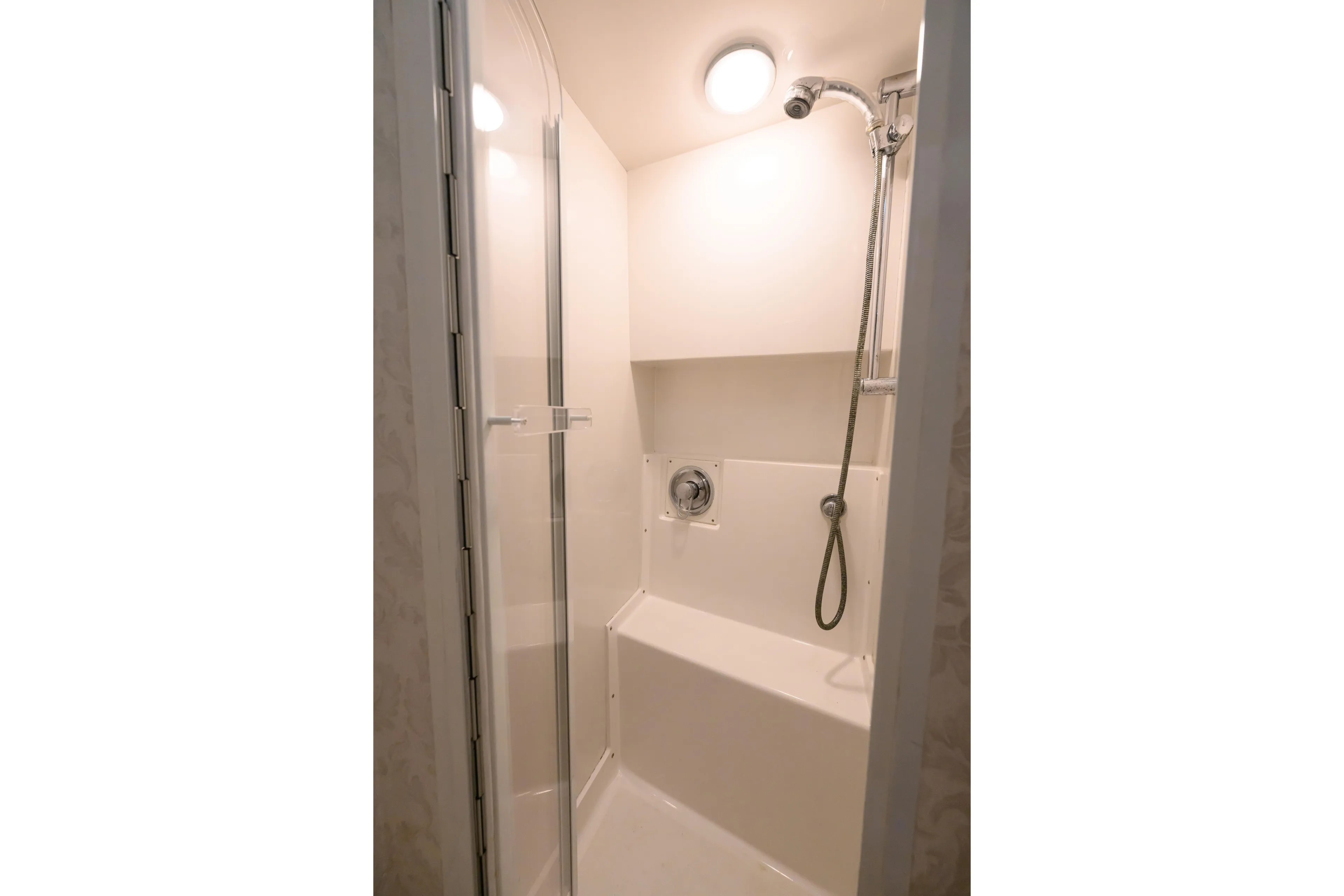 Marlin Spike Yacht Photos Pics Shower area in 1998 Bertram 36 Moppie boat, featuring modern fixtures and lighting.