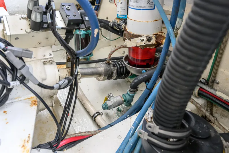 Marlin Spike Yacht Photos Pics Engine room of a 1998 Bertram 36 Moppie with visible mechanical components and wiring.