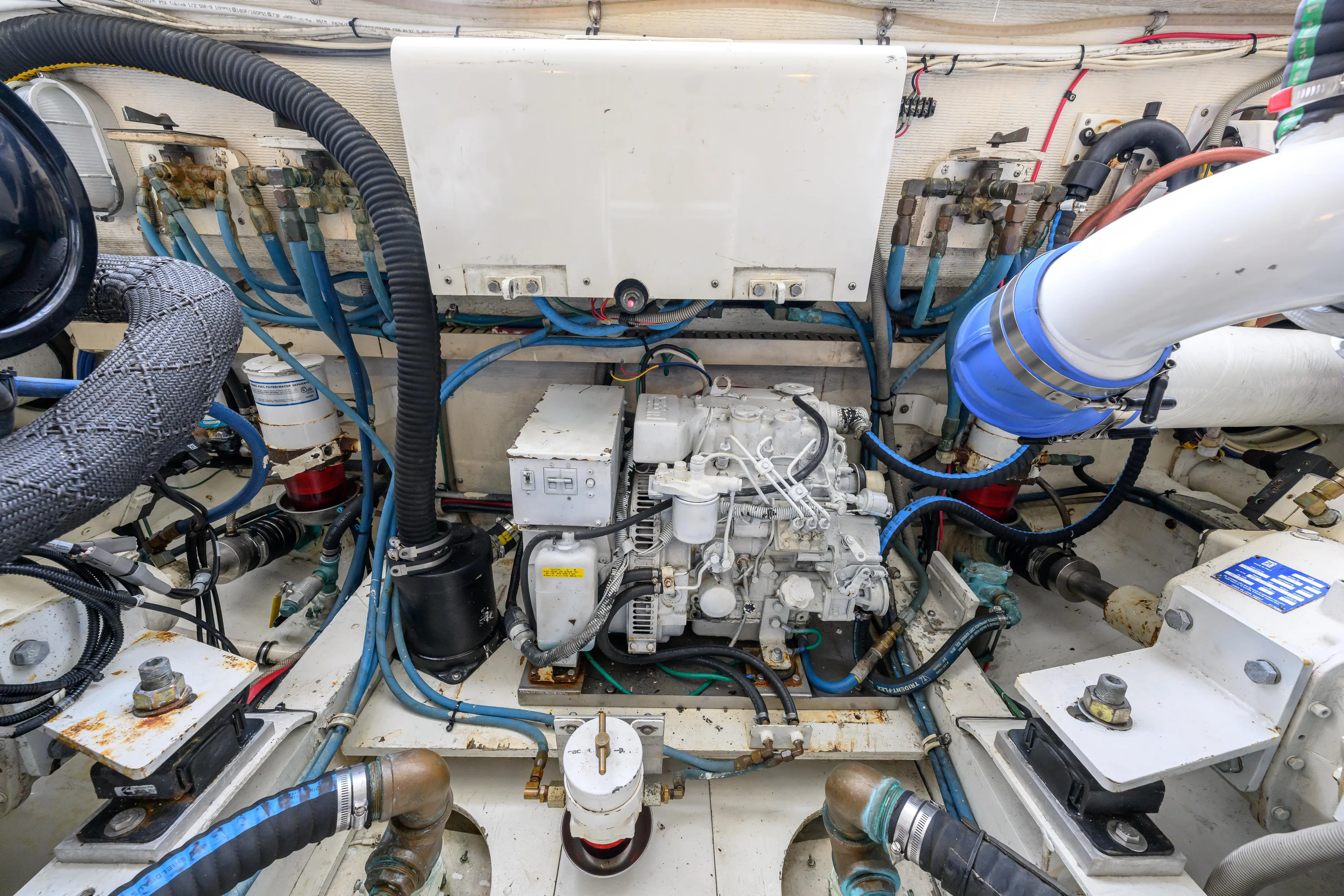 Marlin Spike Yacht Photos Pics Engine room of a 1998 Bertram 36 Moppie boat, showcasing mechanical components.