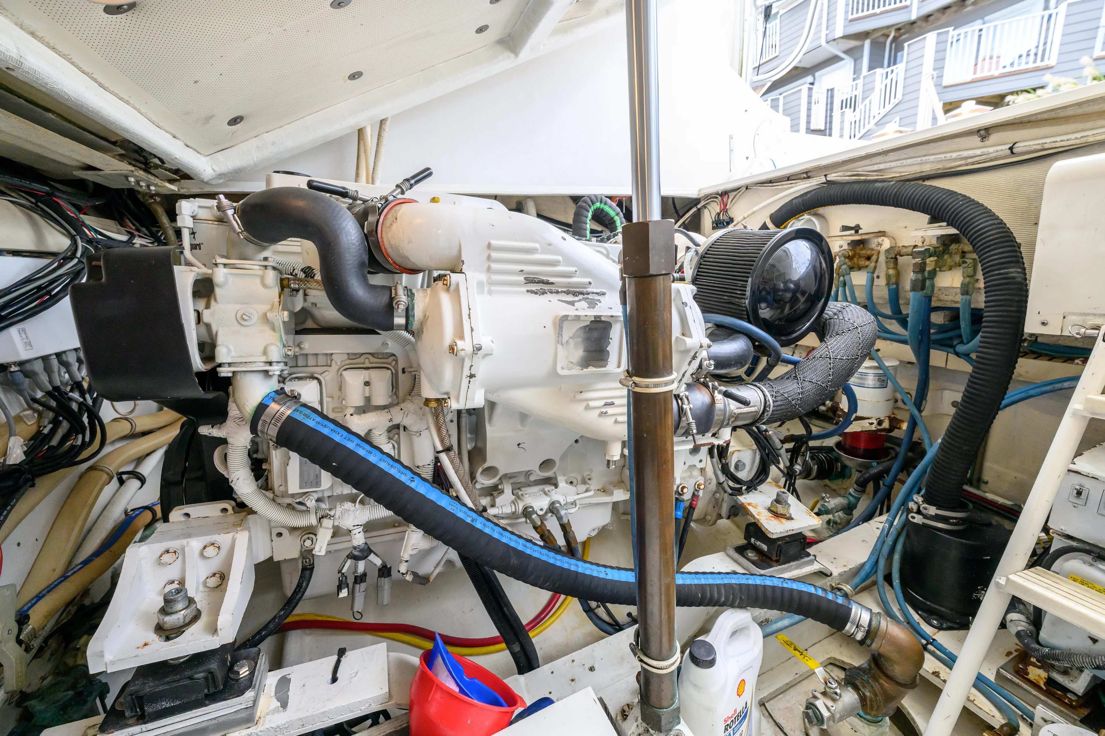 Marlin Spike Yacht Photos Pics Engine room of a 1998 Bertram 36 Moppie boat, showcasing detailed machinery and components.