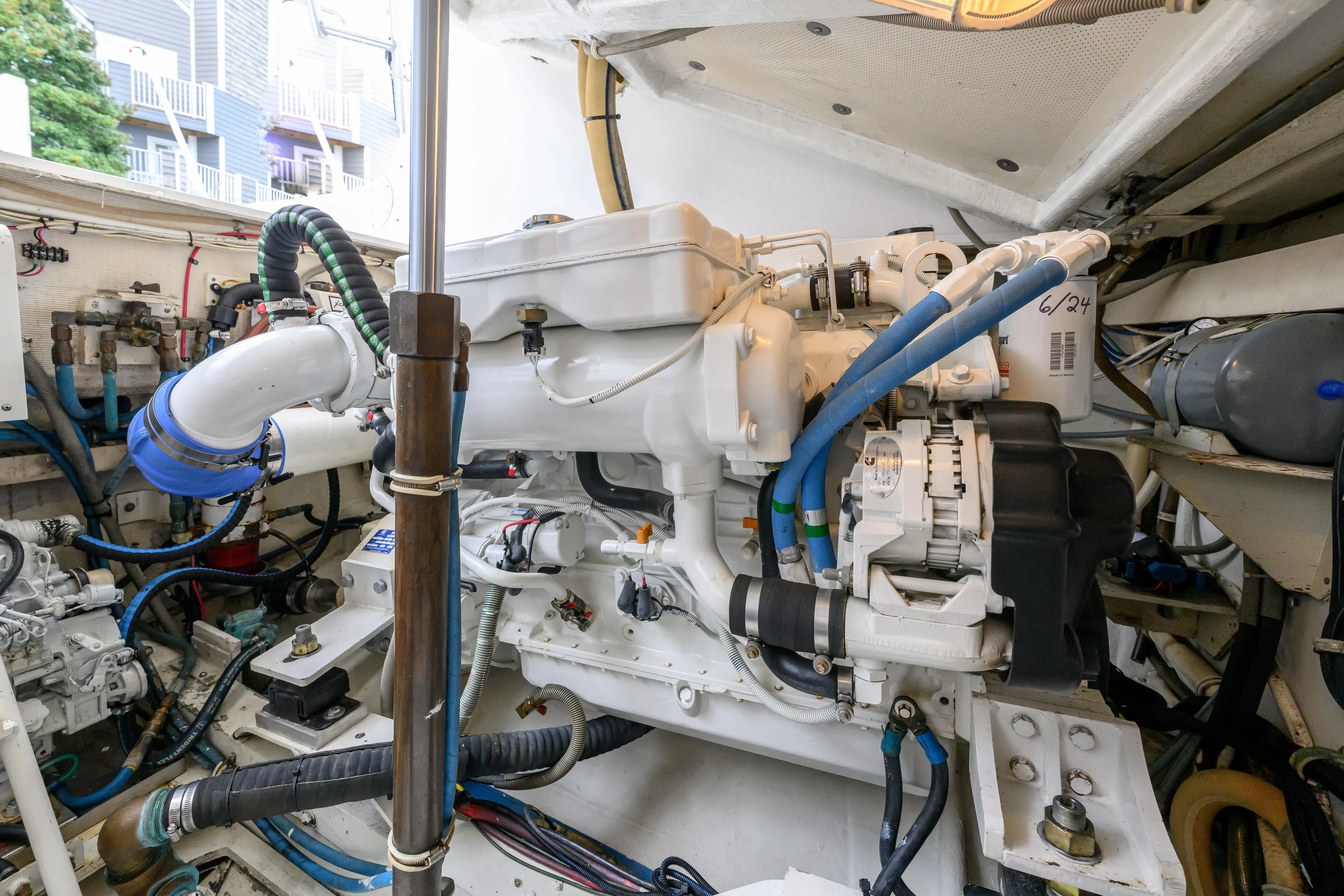 Marlin Spike Yacht Photos Pics Engine room of a 1998 Bertram 36 Moppie boat, showcasing detailed machinery.