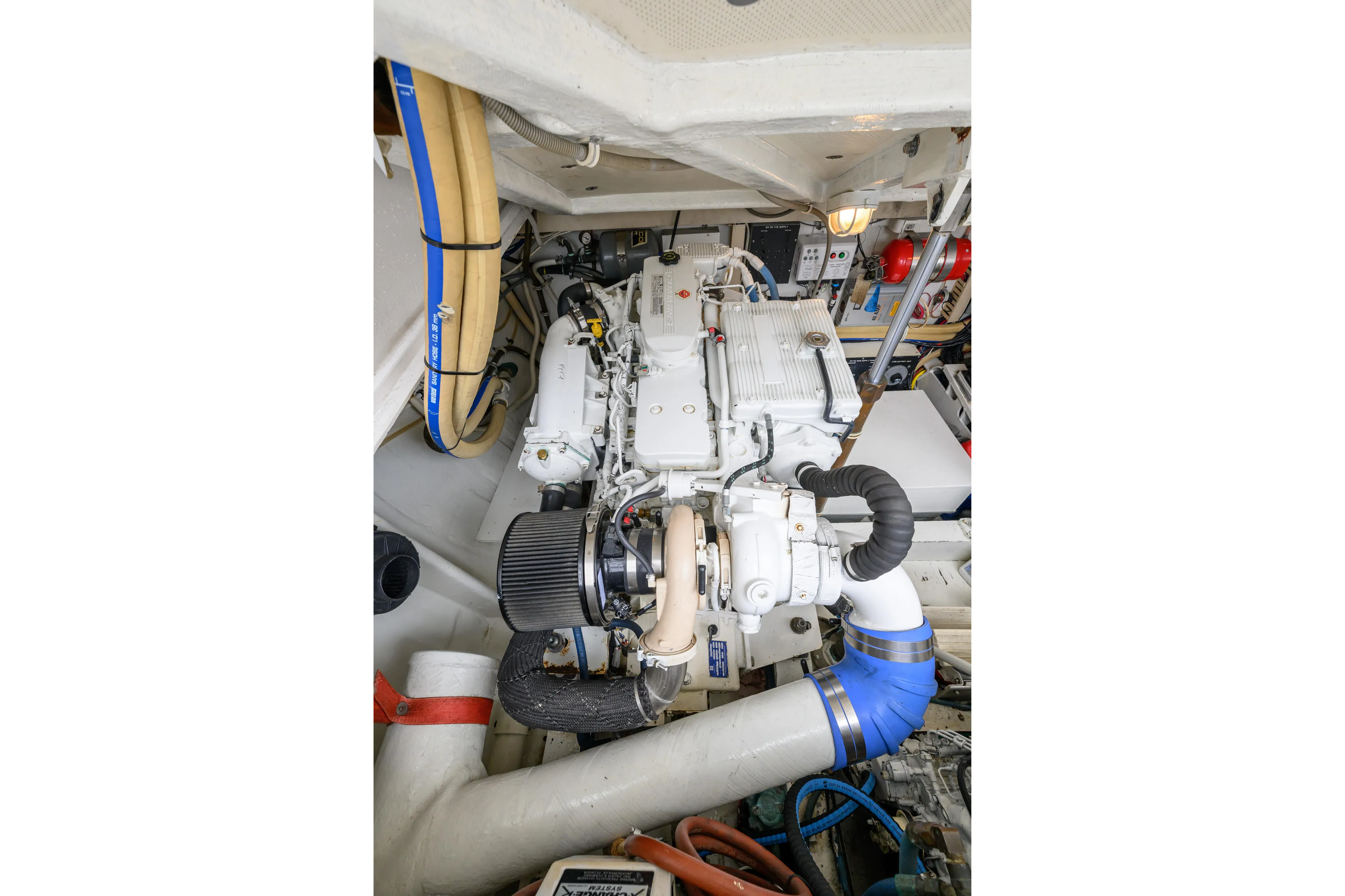 Marlin Spike Yacht Photos Pics Engine room of a 1998 Bertram 36 Moppie boat, showcasing mechanical components.