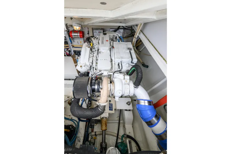 Marlin Spike Yacht Photos Pics Engine compartment of a 1998 Bertram 36 Moppie boat, showcasing detailed mechanical components.
