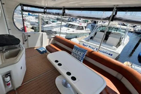 Infinity 2 Yacht Photos Pics Luxurious 2004 Sea Ray 390 Motor Yacht interior with seating and marina view.