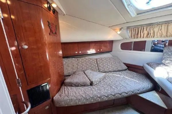 Infinity 2 Yacht Photos Pics Luxurious 2004 Sea Ray 390 Motor Yacht interior with cozy seating and elegant wood finish.