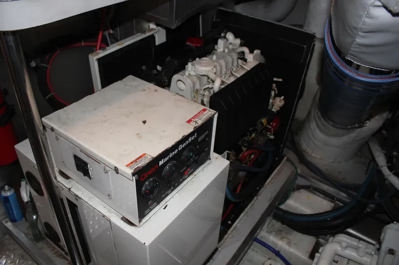 Allegro Yacht Photos Pics Engine room of 1999 Horizon 70 Motor Yacht with Onan Marine GenSet.