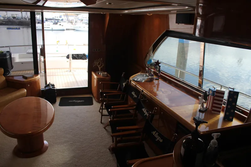 Allegro Yacht Photos Pics Interior of 1999 Horizon 70 Motor Yacht with elegant wood furnishings and marina view.