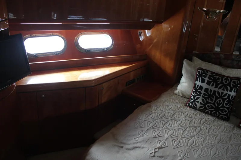 Allegro Yacht Photos Pics Luxurious cabin interior of 1999 Horizon 70 Motor Yacht with elegant wood finish.
