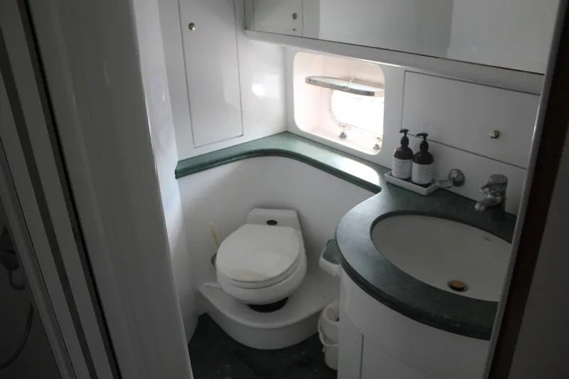 Allegro Yacht Photos Pics Bathroom interior of 1999 Horizon 70 Motor Yacht with sink and toilet.