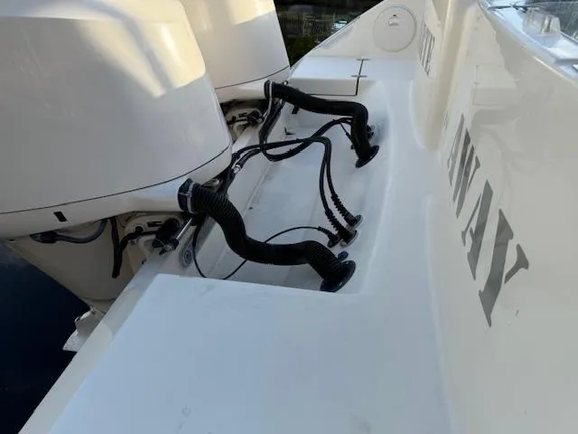  Yacht Photos Pics 2018 Cobia 320 CC boat with dual outboard motors and visible wiring.