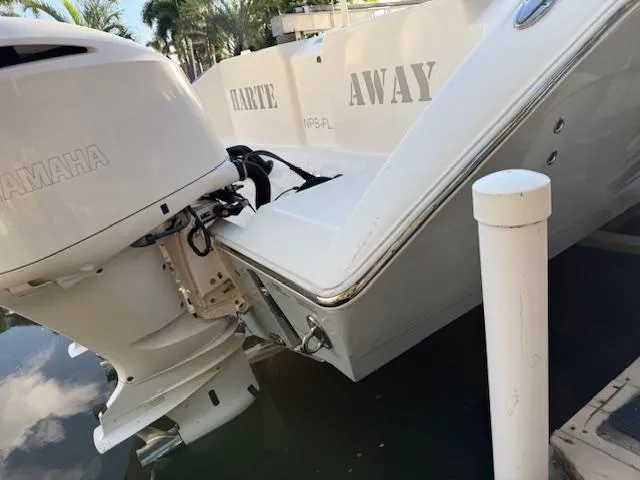  Yacht Photos Pics 2018 Cobia 320 CC boat with Yamaha outboard motor, docked near water.