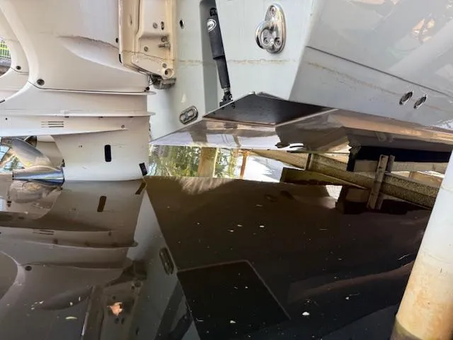  Yacht Photos Pics 2018 Cobia 320 CC boat hull and transom detail in docked position.