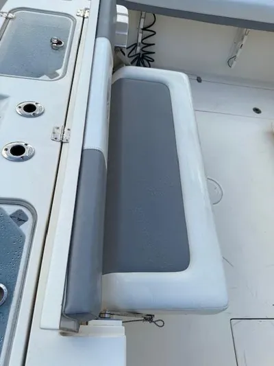  Yacht Photos Pics 2018 Cobia 320 CC boat interior with gray and white seating.