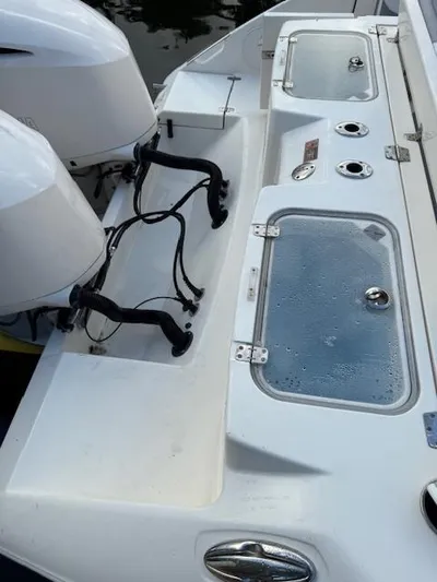  Yacht Photos Pics 2018 Cobia 320 CC boat with dual engines and livewell compartments.