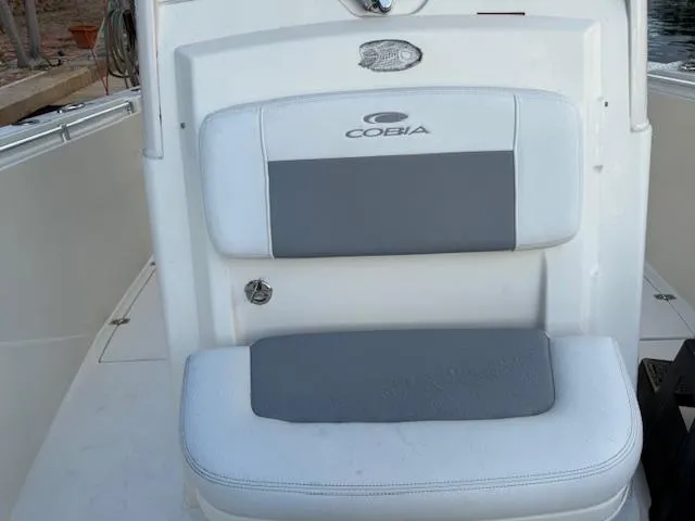  Yacht Photos Pics 2018 Cobia 320 CC boat seat with gray and white upholstery.