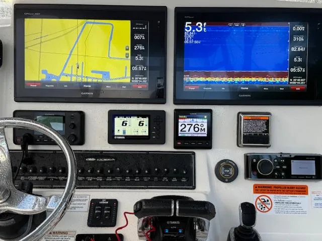  Yacht Photos Pics 2018 Cobia 320 CC dashboard with navigation and control displays.