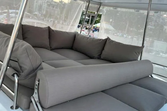  Yacht Photos Pics Luxurious seating area on 2022 Lagoon 50 yacht with plush gray cushions.