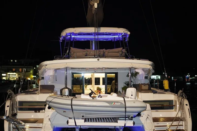  Yacht Photos Pics 2022 Lagoon 50 yacht illuminated at night, showcasing luxury and modern design.