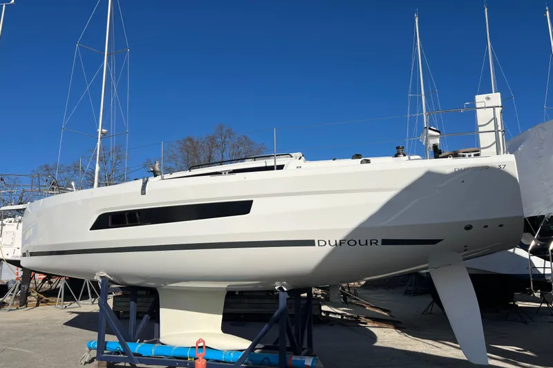  Yacht Photos Pics 2026 Dufour 37 sailboat on dry dock under clear blue sky.