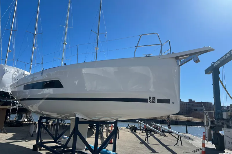  Yacht Photos Pics 2026 Dufour 37 sailboat on stands, marina background, clear blue sky.