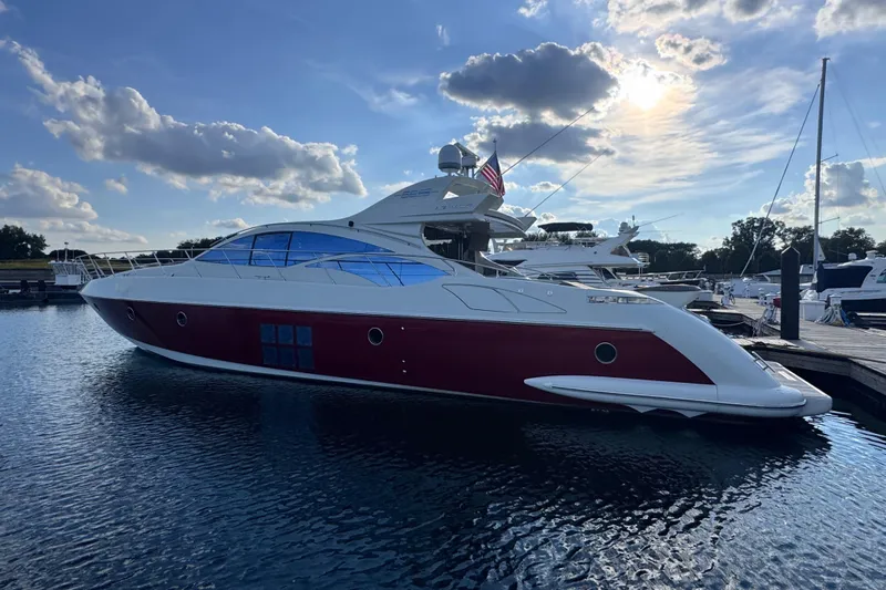  Yacht Photos Pics Luxury 2006 Azimut 68S yacht docked at marina under blue sky.