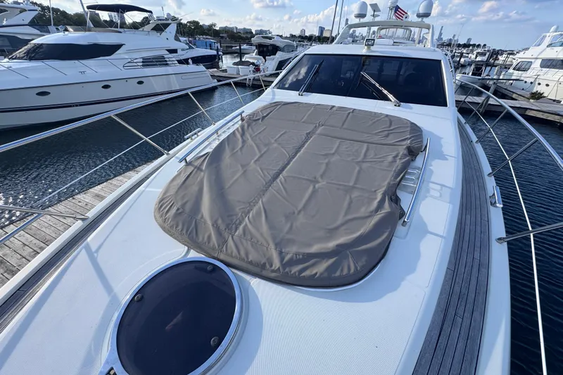  Yacht Photos Pics 2006 Azimut 68S yacht docked at marina, featuring sleek design and sunbathing area.