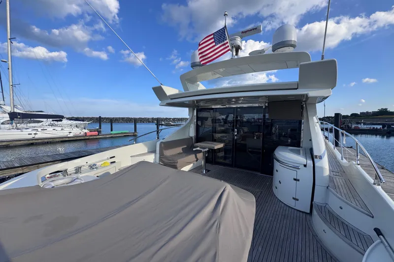  Yacht Photos Pics Luxurious 2006 Azimut 68S yacht docked, featuring spacious deck and elegant design.