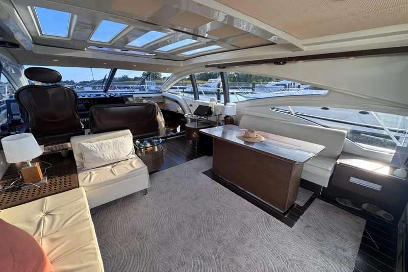  Yacht Photos Pics Luxurious interior of a 2006 Azimut 68S yacht with elegant seating and panoramic windows.