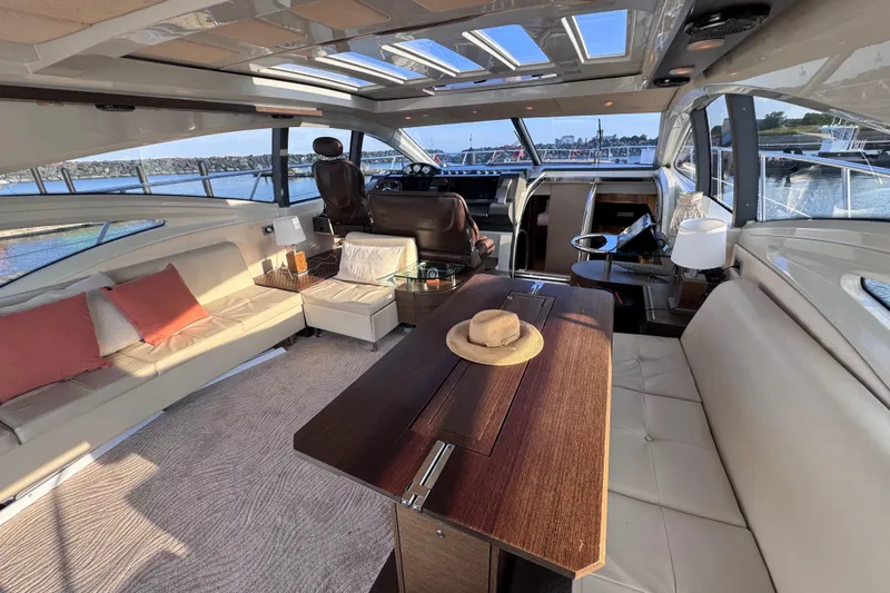  Yacht Photos Pics Luxurious interior of 2006 Azimut 68S yacht with elegant seating and panoramic windows.