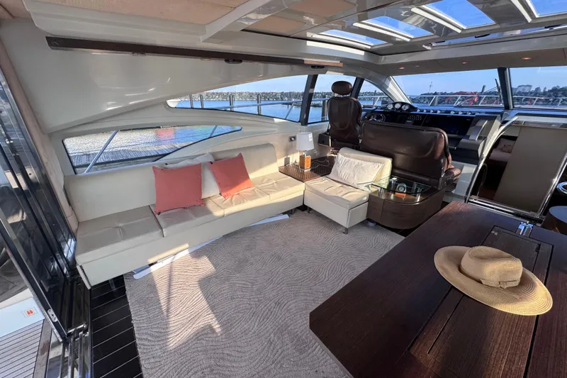  Yacht Photos Pics Luxurious interior of a 2006 Azimut 68S yacht with elegant seating and panoramic windows.
