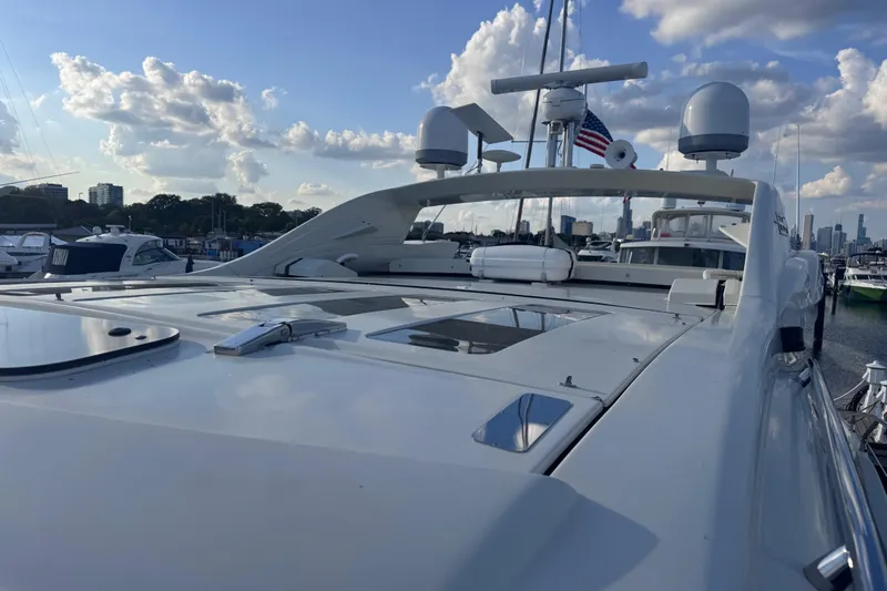  Yacht Photos Pics 2006 Azimut 68S yacht docked, showcasing sleek design under a partly cloudy sky.