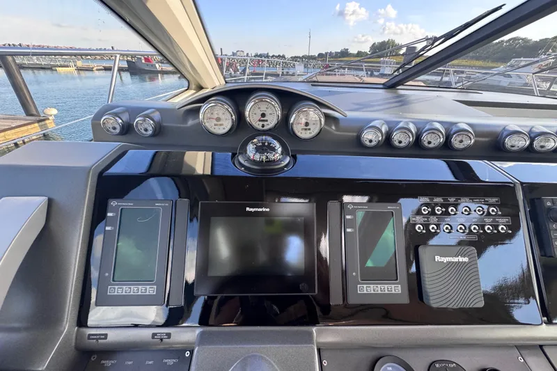  Yacht Photos Pics Control panel of a 2006 Azimut 68S yacht with Raymarine navigation displays.