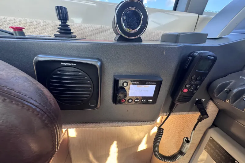  Yacht Photos Pics Control panel of a 2006 Azimut 68S yacht featuring Raymarine and Fusion equipment.